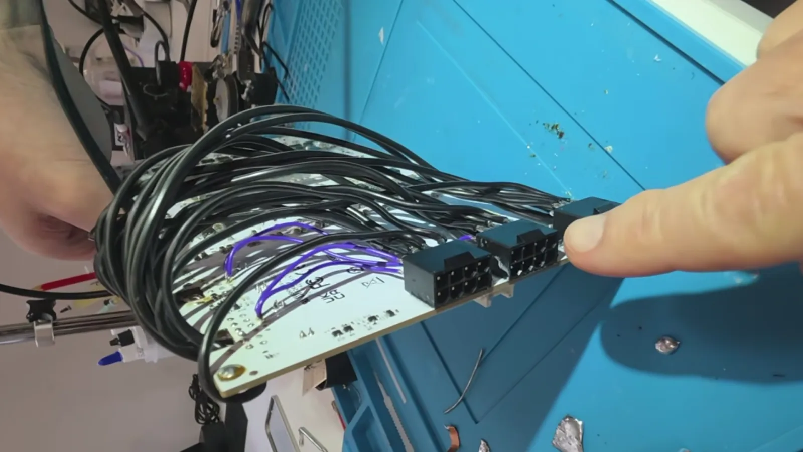 Modded RTX 5090 ditches 16-pin power for triple 8-pin connectors — draws up to 900W and hits 3,400 MHz